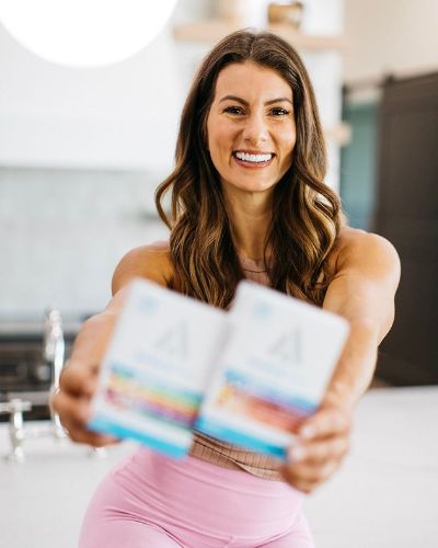 Picture of Jennifer Widerstorm with GetUp CBD product